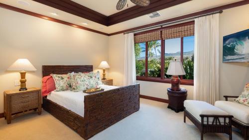 a bedroom with a large bed and a window at ❤PiH❤ Ikena Nani Ocean Coastline Views Mauna Kea Resort in Waimea