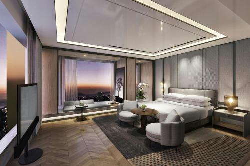 a bedroom with a bed and a large window at Sheraton Kota Kinabalu in Kota Kinabalu