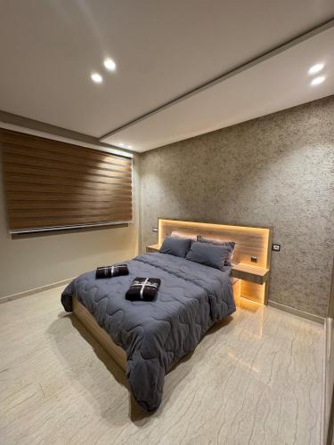 a bedroom with a large bed in a room at Casa Serenity Studio moderne à Casablanca in Casablanca