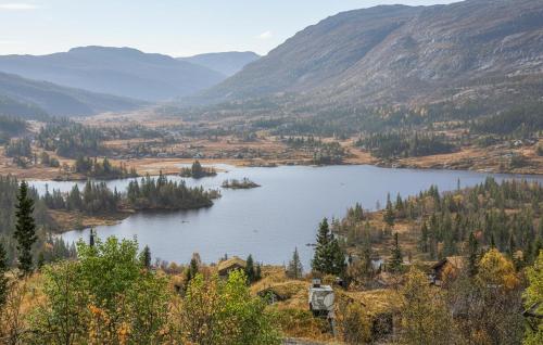 a lake in the middle of a valley with mountains at 4 Bedroom Gorgeous Home In Rjukan in Gaustablikk