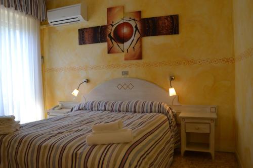 Ένα ή περισσότερα κρεβάτια σε δωμάτιο στο Hotel Eva La Romantica