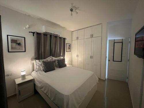 Ένα ή περισσότερα κρεβάτια σε δωμάτιο στο Apartment with pool in the heart of Bayahibe