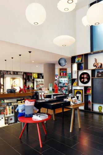 a kitchen with a table and chairs in a room at citizenM New York Bowery in New York