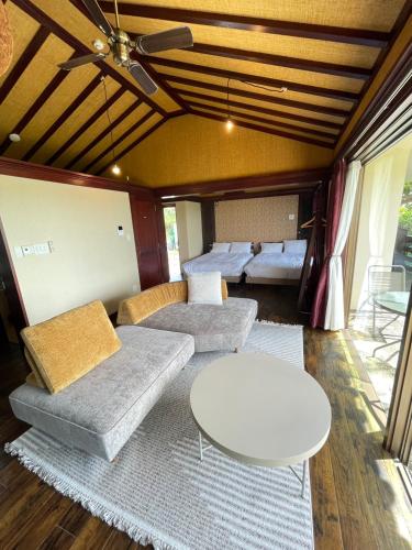 a living room with a couch and a table at Kori Terrace N in Kouri