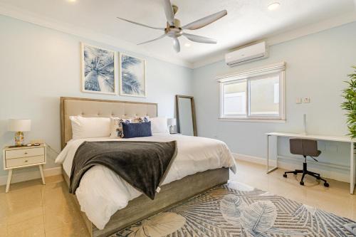 a bedroom with a bed and a ceiling fan at Dream Diamond in Saint Annʼs Bay