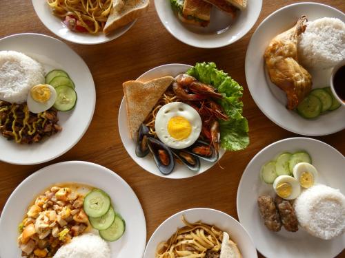 a table full of plates of food with eggs at Lola Sayong Meredith in Gubat