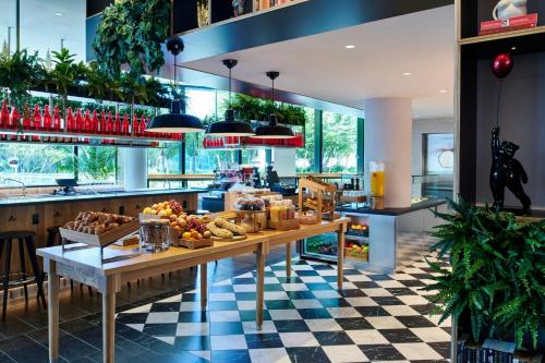 a kitchen with a table with fruit on it at citizenM Boston Back Bay in Boston