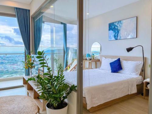 Una cama o camas en una habitación de CĂN HỘ NGHĨ DƯỠNG CAO CẤP THE SONG VŨNG TÀU-THE SONG APARTMENT Mr VƯƠNG