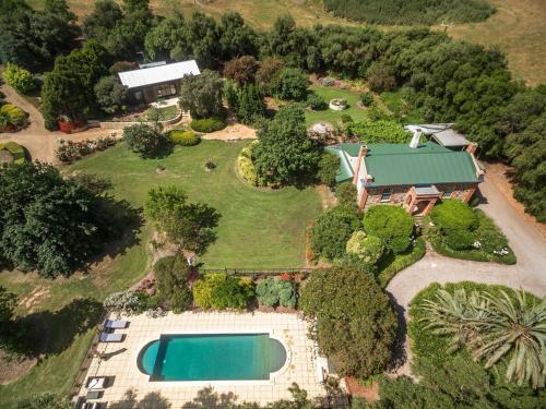 an aerial view of a house with a swimming pool at The Olives Heritage House in Yankalilla