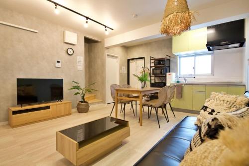 TV a/nebo společenská místnost v ubytování Plus Life Shiraho B