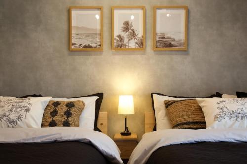 Postel nebo postele na pokoji v ubytování Plus Life Shiraho B