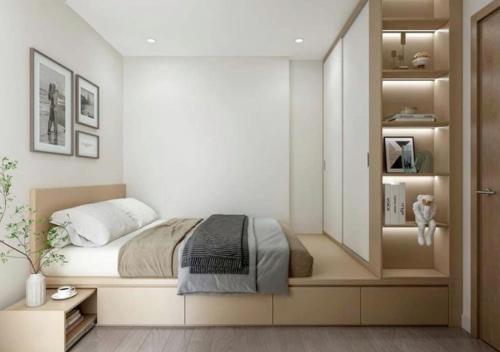 a bedroom with a bed and a mirror at Ơ Kìa Home in Da Nang