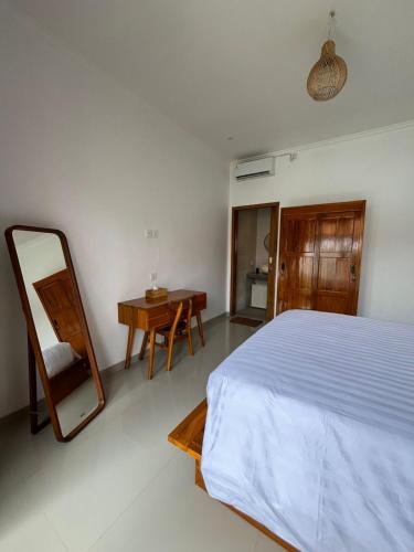 En eller flere senge i et værelse på yudis homestay