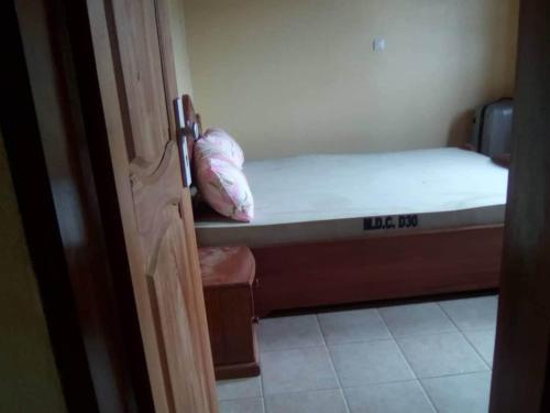 Postel nebo postele na pokoji v ubytování Studio moderne Liboudi Nkolbisson Yaoundé