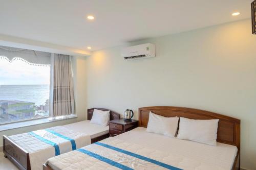 Ένα ή περισσότερα κρεβάτια σε δωμάτιο στο Khu Nghỉ Dưỡng Đoàn 298 - Khách Sạn 3 Tầng