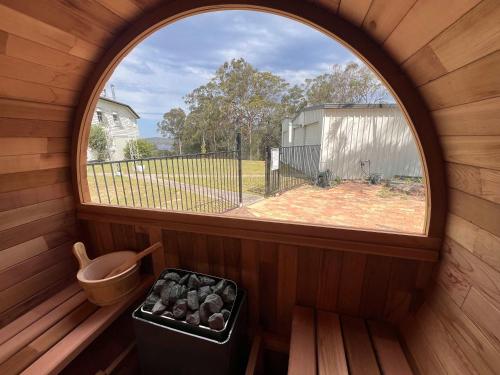 an inside view of a small room with a window at Lakeview Cottage in Mooloolah Valley in Mooloolah