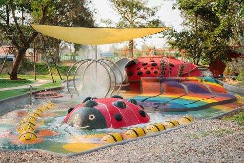 a water slide in a park with two lady bugs at Moyard Khaoyai in Ban Khanong Phra Klang (1)