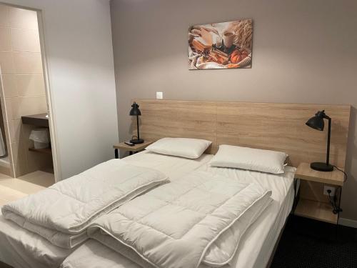 a bedroom with a large bed with white sheets at Gourette : Studio cabine 58m² pour 6 pers, Animaux admis - FR-1-860-32 in Gourette