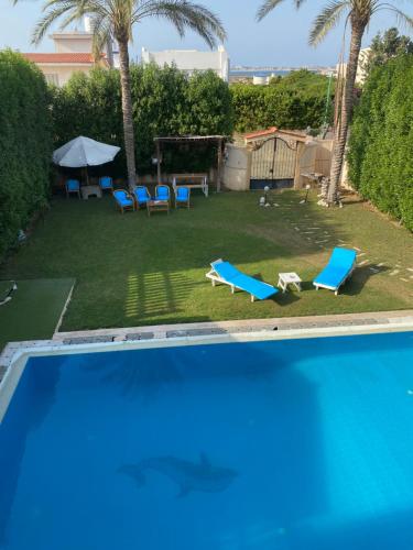A piscina em ou perto de Lovely Villa 5- bedroom with Overflow Pool with Nice Garden at Green Oasis Resort