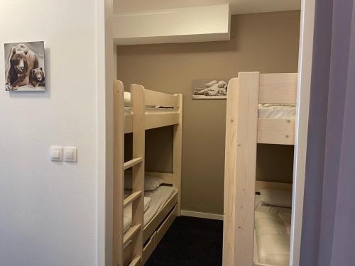 a room with two bunk beds in a room at Studio à Gourette avec piscine, 6 pers - Animaux admis - FR-1-860-44 in Gourette