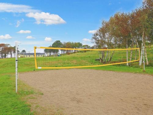 a volleyball net on a field in a park at 6 person holiday park home in Gilleleje in Gilleleje