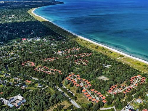 an aerial view of a resort next to the ocean at 6 person holiday home in Væggerløse in Bøtø By