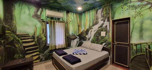 Postel nebo postele na pokoji v ubytování Aabhai Beach Resort