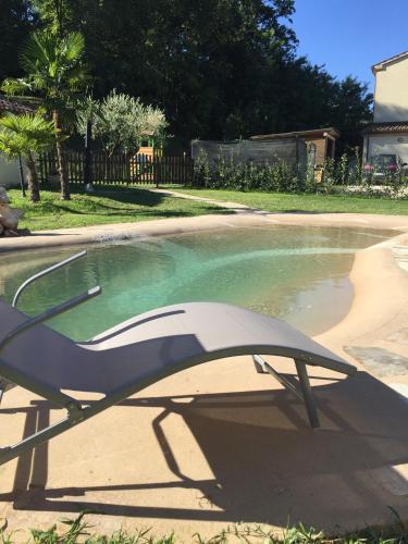 a pool of water with a chair in it at Locanda Montelippo in Colbordolo