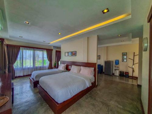 Postel nebo postele na pokoji v ubytování Retreat Siargao Resort