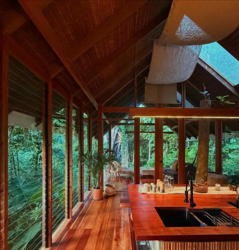 a kitchen with a sink in a house with windows at Dalakit House Hidden Gem, Tranquility Nearby town in Siquijor