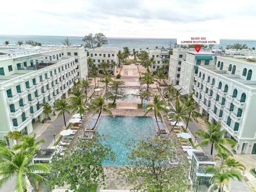 an aerial view of the resort with a swimming pool and the ocean at Lumiere Boutique Phu Quoc Hotel in Phu Quoc