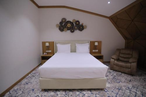 Ένα ή περισσότερα κρεβάτια σε δωμάτιο στο Hotel Elegant