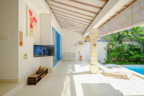 a hallway of a house with a swimming pool at Villa Beji Ayu Seminyak - 2 Bedroom Private Pool in Seminyak