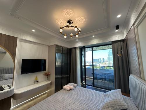 Postel nebo postele na pokoji v ubytování Апартаменты в элитном ЖК NRG U-TOWER