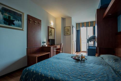 Ένα ή περισσότερα κρεβάτια σε δωμάτιο στο Park Hotel Perù ***S
