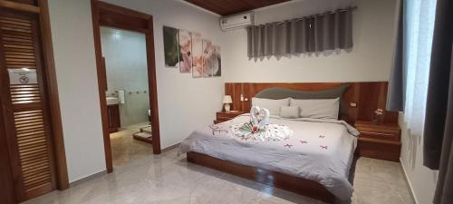 Ένα ή περισσότερα κρεβάτια σε δωμάτιο στο Casa Paraíso Fortuna