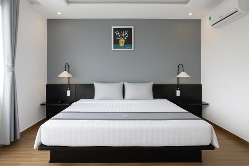 Postel nebo postele na pokoji v ubytování Sunset Hill Resort Phú Quốc