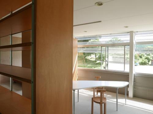 a dining room with a table and a window at OGUNI S HOUSE 2F Designed by Toyo Ito in Oguni