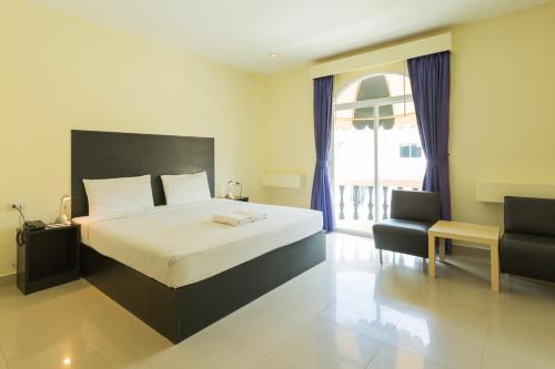 เตียงในห้องที่ Zing Resort & Spa