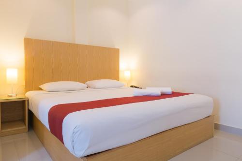 เตียงในห้องที่ Zing Resort & Spa