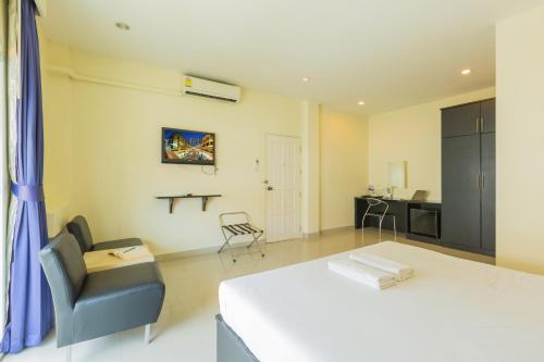 เตียงในห้องที่ Zing Resort & Spa