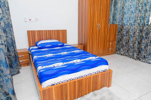 Giường trong phòng chung tại Servmark Grace Home