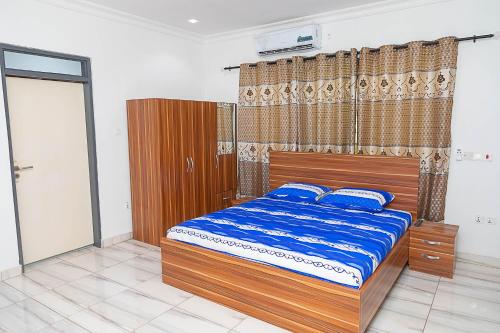 Giường trong phòng chung tại Servmark Grace Home