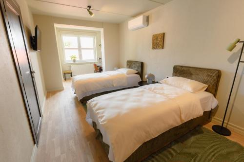 Ένα ή περισσότερα κρεβάτια σε δωμάτιο στο Pievos