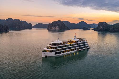 a cruise ship in halong bay at sunset at L'amour Cruise in Ha Long