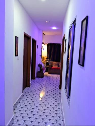a hallway with a light in the middle of a room at Hotel Baruah Tower in Tezpur
