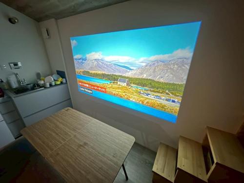 TV a/nebo společenská místnost v ubytování グランピーナアウトドアーズマキノ