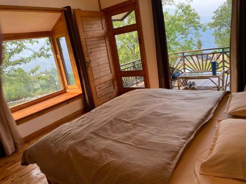 Ένα ή περισσότερα κρεβάτια σε δωμάτιο στο The Goat Village