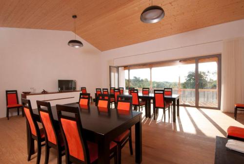 a dining room with a table and chairs at Casal de Palácios in Bragança