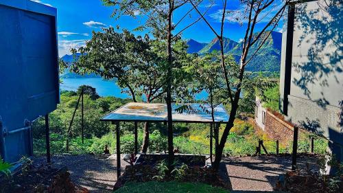 a building with a table with a tree in it at The Chalets, Mulshi in Wadgaon